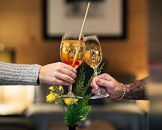 Toasting with wine glasses