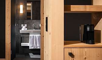 View of a stylish bathroom with towels and a sink.