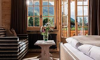 Bright room with window and view of the mountains.